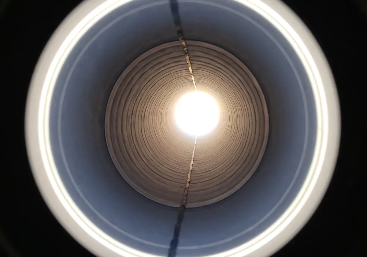 After — chimney inspection: The camera going up the flue — and the liner defect a look from the hearth would never have found.